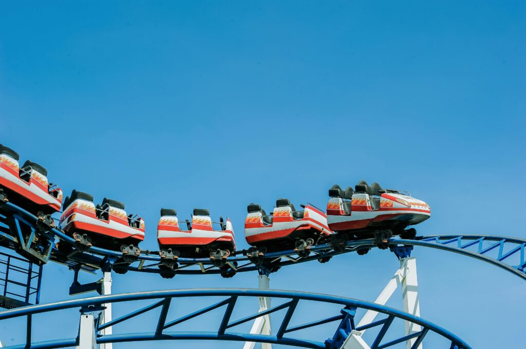 pexels-photo-749061-749061 Exciting roller coaster ride with vibrant colors against a clear blue sky.